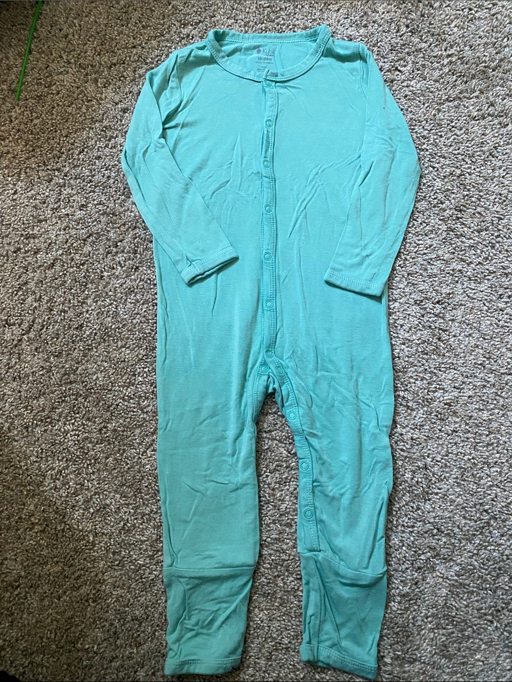 Kyte Baby unisex romper with a snap closure